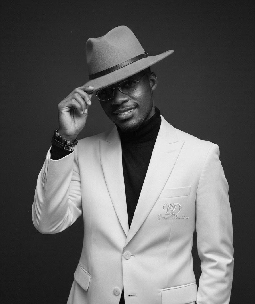 Daniel Daviston in white suit and fedora